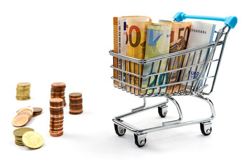 shopping cart full of euro banknotes isolated on white. Concept: loan, investment, pension, saving money, financing, collateral, debt, mortgage, financial crisis or rise, rise or fall of shares