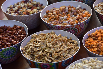 Nuts and other nuts in pretty decorated bowls