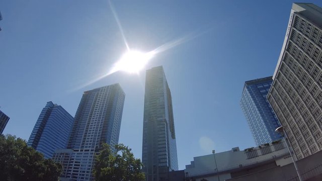 Sunny Blue Sky Business Background with Corporate Skyscraper Buildings