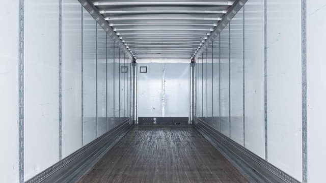 Empty semi trailer, perspective view, dolly zoom shot. Logistics and freight background 