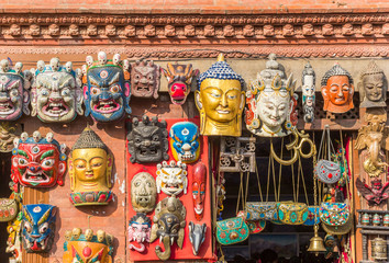 Buddhist masks at a souvenir shop in Kathmandu, Nepal - obrazy, fototapety, plakaty