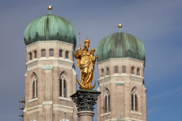 Saint Mary Column on Saint Mary Square in Munich, Germany, with the spires of Saint Mary Church in the background