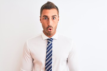 Young handsome elegant business man over isolated background afraid and shocked with surprise expression, fear and excited face.