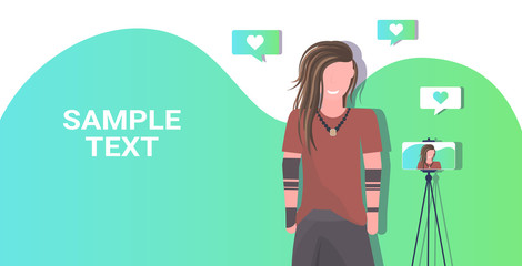 man blogger recording video blog with digital camera or smartphone on tripod live streaming social media blogging concept portrait horizontal copy space vector illustration
