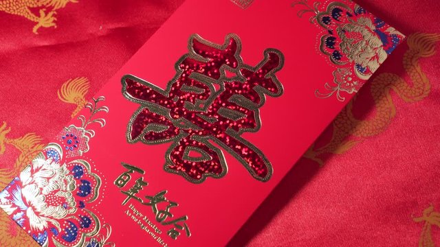 Someone give a card with a Chinese symbol mean "Double Happiness" for anyone. Marriage occasion. Wedding occasion. usually with money inside.