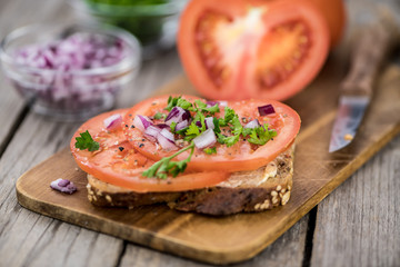 Some fresh Tomato Sandwich (selective focus; close-up shot)