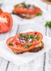 Some fresh Tomato Sandwich (selective focus; close-up shot)
