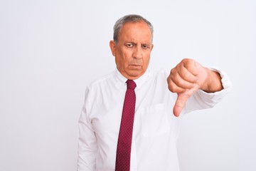 Senior grey-haired businessman wearing elegant tie over isolated white background looking unhappy and angry showing rejection and negative with thumbs down gesture. Bad expression.