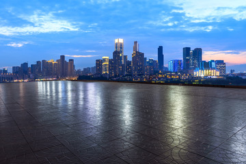 Fototapeta na wymiar Empty square floor and city skyline with buildings in Chongqing at night,China.
