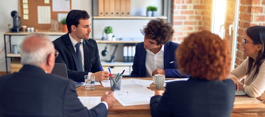 Group of business workers smiling happy and confident. Speaking with smile on face working together at the office.