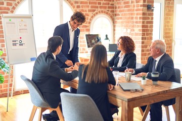 Group of business workers working together in a meeting. Listening one of them speaking at the office.