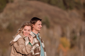 Young Beautiful Couple In Love Standing Outdoors In Nature