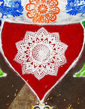 View of Rangoli drawn on floor during Indian Hindu festival Pongal or makar Sankranti, usually in front of home or temple            