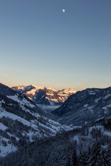 Snowy mountains sunset landscape mountainscape moonrise moon valley view