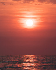 The sun setting over the pacific ocean