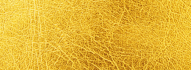 close up shot of bright gold leather texture for banner background