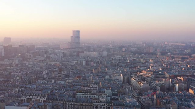 Aerial view of Paris Judicial Campus Batignolles France skyline rooftops pollution sunset 