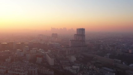 Sunset over Paris justice tribunal glass modern building la Defense business area in background France 