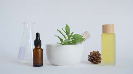 aromatherapy oil with mortar and natural green leaf