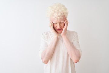 Young albino blond man wearing casual t-shirt standing over isolated white background with hand on...