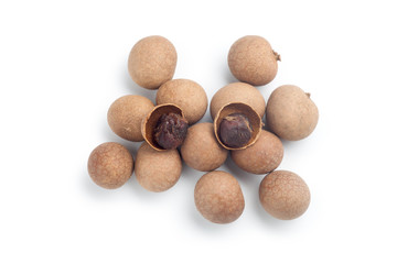 Pile of dried longan isolated on white background. Top view.