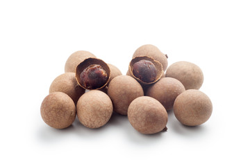 Pile of dried longan isolated on white background