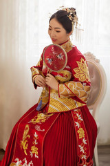 Asian girl wearing chinese wedding costume