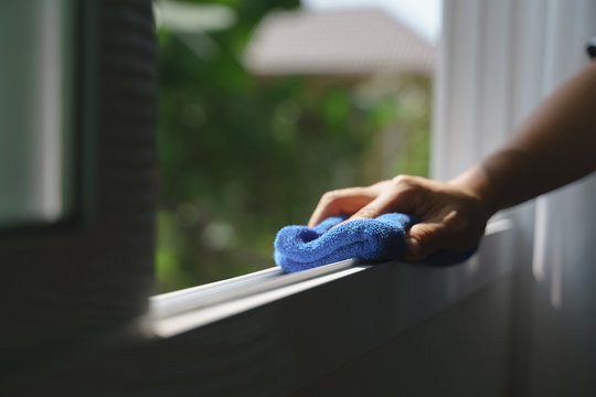 Hand holding microfiber cloth for cleaning