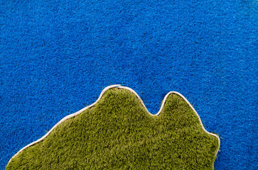 Carpet texture. Blue and green carpet on the street decor.