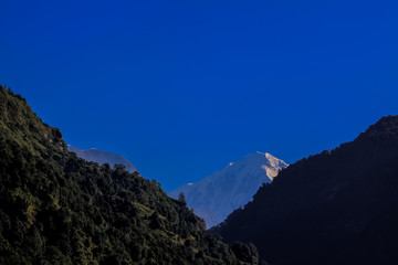 Fototapeta premium Snow-covered Mountain With Blue Sky, Cloud and Fog