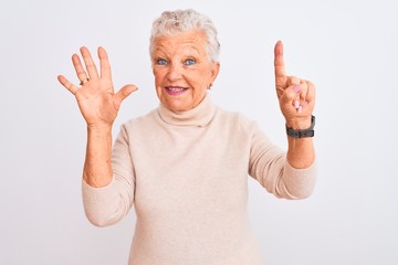 Senior grey-haired woman wearing turtleneck sweater standing over isolated white background showing and pointing up with fingers number six while smiling confident and happy.