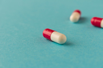 Pills on a blue background. Close up. Selective focus.