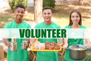 Young volunteers with food for poor people outdoors