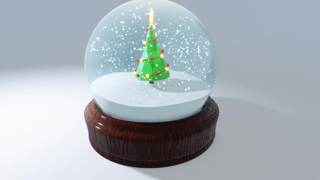 Orbiting animation of CGI christmas tree in snow globe