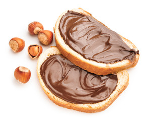 Fresh bread with chocolate paste on white background