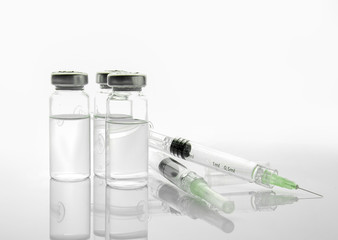 Syringes and ampules with filler for cosmetology on white background