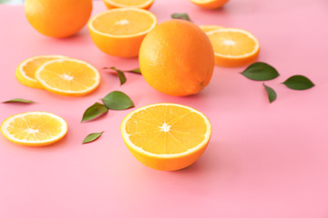 Fototapeta na wymiar Sweet oranges on color background