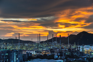 Oil refinery and petrochemical plants Steel pipe equipment at sunrise background