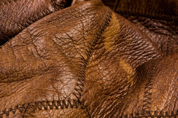 Old vintage genuine soft brown leather texture background, top layer with pores and scratches,...