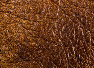 Old vintage genuine soft brown leather texture background, top layer with pores and scratches,...