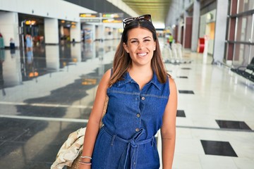 Young traveller woman at the airport going on vacation