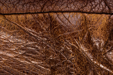 Old vintage genuine soft brown leather texture background, top layer with pores and scratches,...