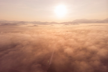 fog covered mountain at sunrise