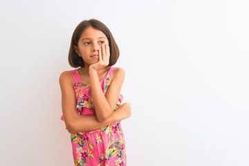 Young beautiful child girl wearing pink floral dress standing over isolated white background thinking looking tired and bored with depression problems with crossed arms.