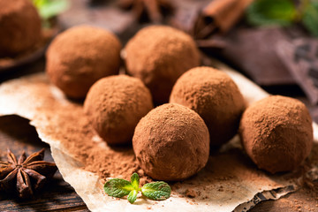 Homemade chocolate truffles with cocoa powder closeup view. Tasty chocolates, confectionary concept