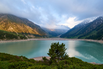 Naklejka na ściany i meble Big Almaty lake in the mountains. Blurred water effect. Ile-Alatau National Park. Kazakhstan.