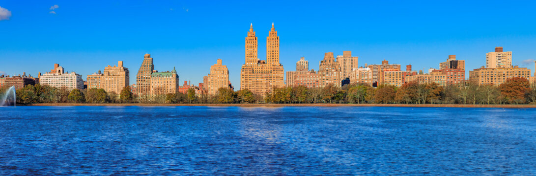 Panorama of New York Manhattan Upper west side skyline across the Jacqueline Kennedy Onassis Reservoir in Central Park