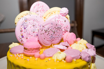 Peach colored cake with meringue and Candy for a child's birthday. Holiday table for children, cake, sweets, sweet food. Candy bar.