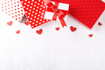 Red and white gift boxes with hearts