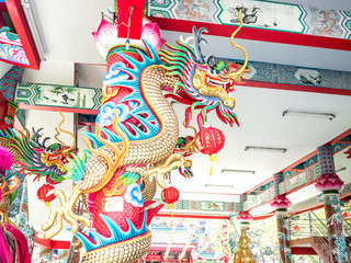 Sky blue have mask dragon demon monster  icon red, green gold color on roof churches and temple and float lamp lanterns is happy chinese new year asia culture decoration shanghai and thailand buddhism